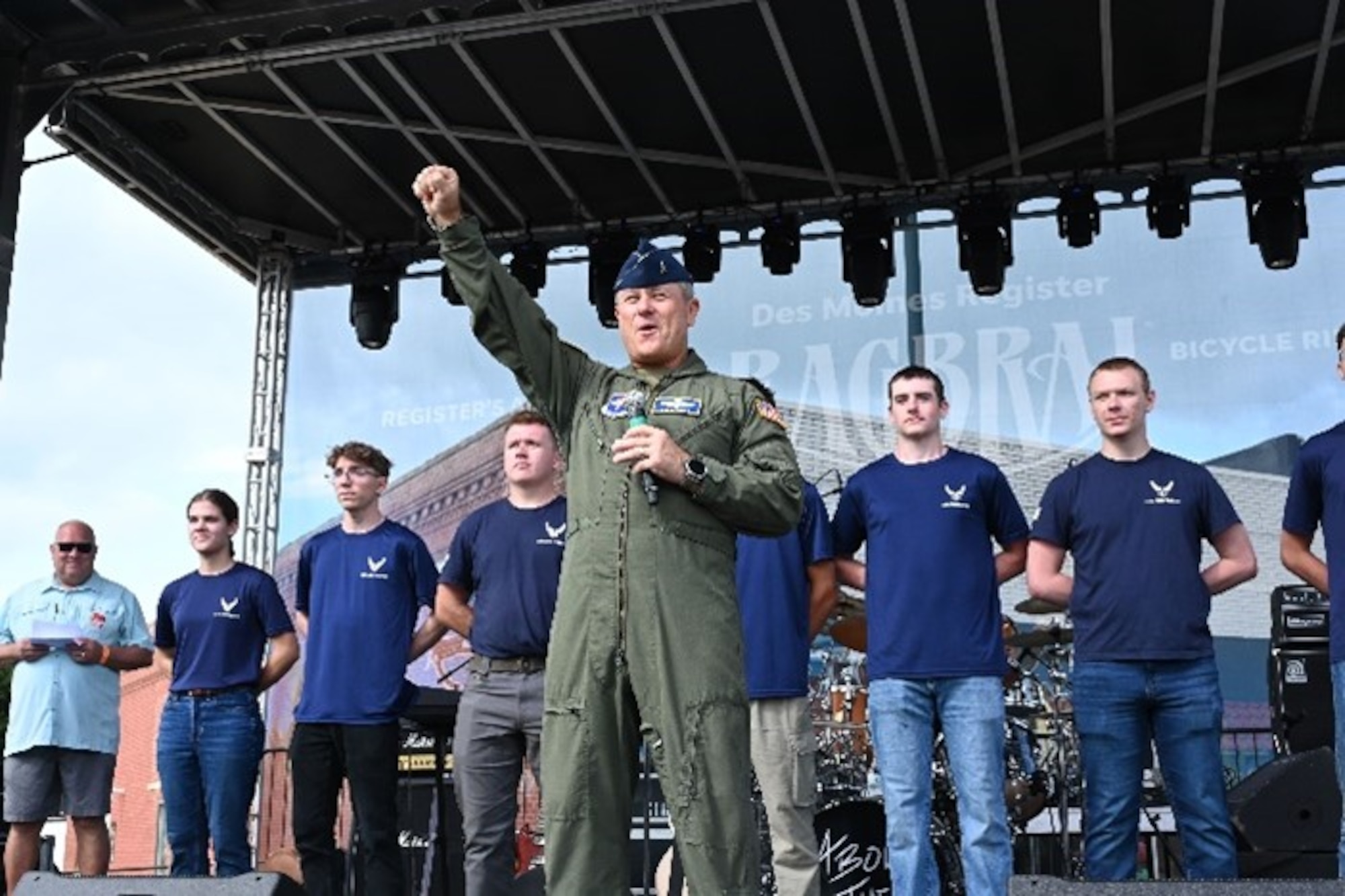 Brig. Gen. Craig McPike, Air Force Recruiting Service deputy commander, celebrates with the crowd at the Register’s Annual Great Bicycle Ride Across Iowa in Orange City, Iowa, July 19, 2025.