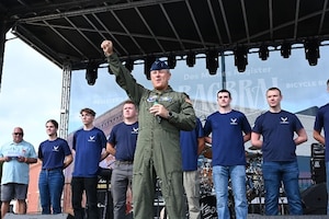 Brig. Gen. Craig McPike, Air Force Recruiting Service deputy commander, celebrates with the crowd at the Register’s Annual Great Bicycle Ride Across Iowa in Orange City, Iowa, July 19, 2025.