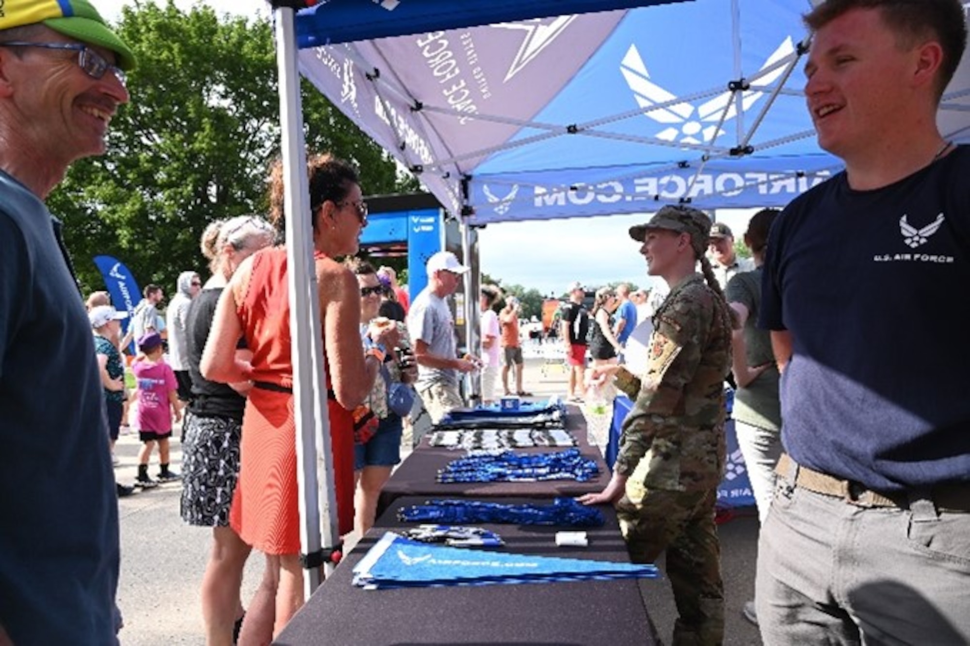 Staff Sgt. Mariah Faulkingham, 343rd Recruiting Squadron enlisted accessions recruiter, talks to some attendees at the Register’s Annual Great Bicycle Ride Across Iowa in Orange City, Iowa, July 19, 2025