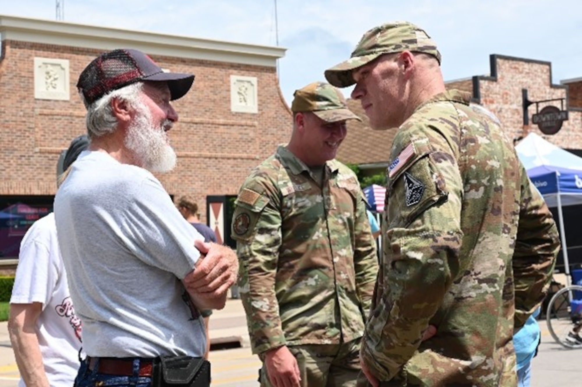 Lt. Col. Zachery Leonard, 343rd Recruiting Squadron commander, talks to an attendee at the Register’s Annual Great Bicycle Ride Across Iowa in Orange City, Iowa, July 19, 2025