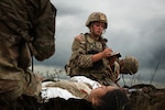 U.S. Army Spc. Meadow Wilkins with Charlie Company, 181st Brigade Support Battalion, 81st Stryker Brigade Combat Team, Washington National Guard, triages a patient during mass casualty training at Yakima Training Center, Wash., July 20, 2025. Mass casualty training is crucial for preparing medical teams to triage, stabilize, and evacuate patients in combat environments, thereby enhancing their readiness for large-scale operations.