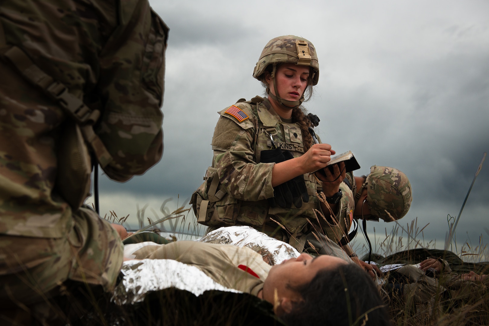 U.S. Army Spc. Meadow Wilkins with Charlie Company, 181st Brigade Support Battalion, 81st Stryker Brigade Combat Team, Washington National Guard, triages a patient during mass casualty training at Yakima Training Center, Wash., July 20, 2025.