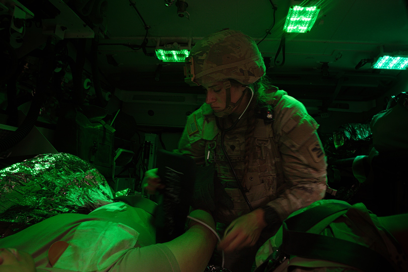 U.S. Army Spc. Meadow Wilkins with Charlie Company, 181st Brigade Support Battalion, 81st Stryker Brigade Combat Team, Washington National Guard, triages a patient during mass casualty training at Yakima Training Center, Wash., July 20, 2025.