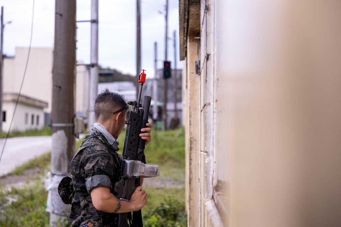A Republic of Korea Marine with 1st Marine Division, ROK conduct military operations in urban terrain training during the Korean Marine Exercise Program 25.2 in Pohang, South Korea, July 21, 2025. KMEP is conducted regularly between the ROK and U.S. Marine Corps to increase their combined capabilities through realistic training geared towards deterring threats and maintaining peace in the Indo-Pacific. (U.S. Marine Corps photo by Cpl. Kanoa Thomas)
