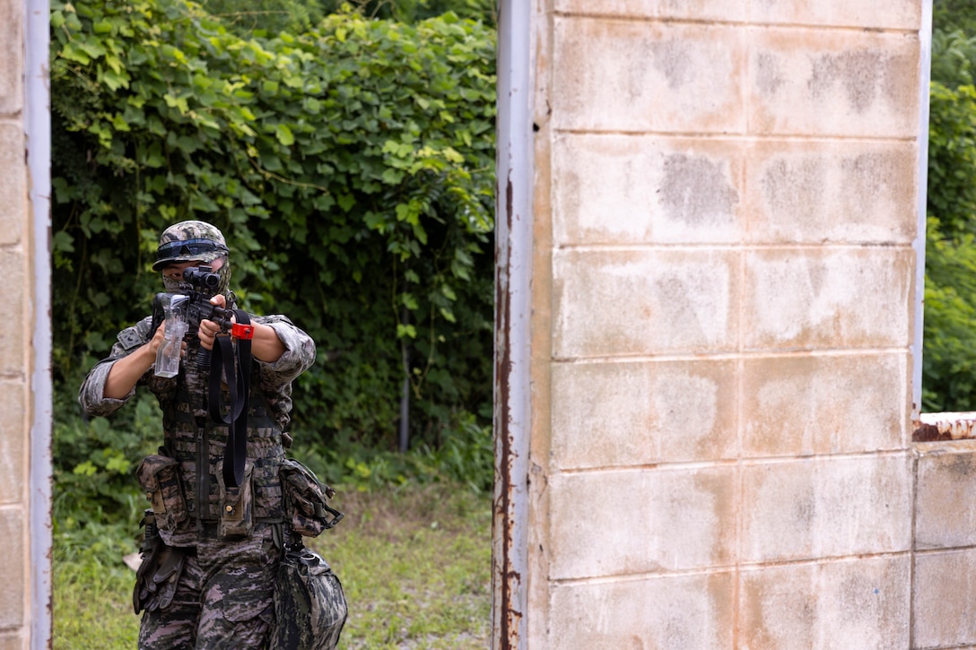 A Republic of Korea Marine with 1st Marine Division, ROK conduct military operations in urban terrain training during the Korean Marine Exercise Program 25.2 in Pohang, South Korea, July 21, 2025. KMEP is conducted regularly between the ROK and U.S. Marine Corps to increase their combined capabilities through realistic training geared towards deterring threats and maintaining peace in the Indo-Pacific. (U.S. Marine Corps photo by Cpl. Kanoa Thomas)