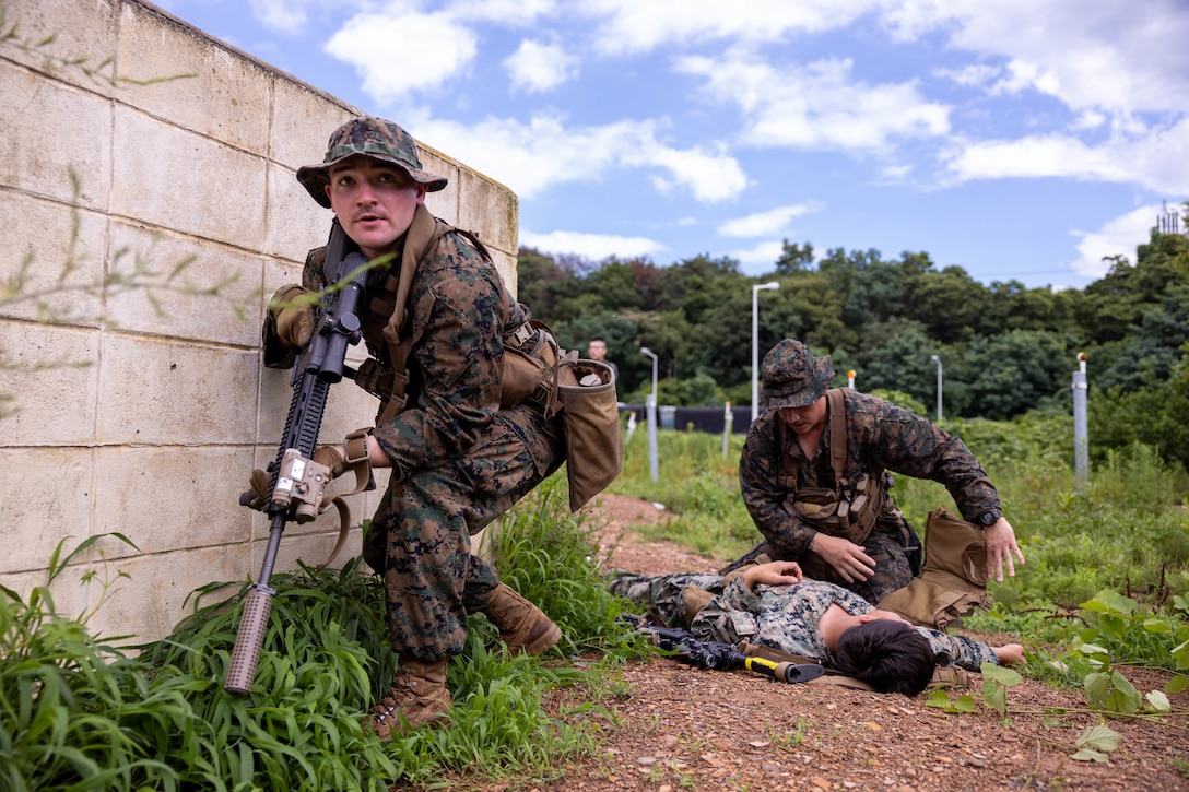 U.S. Marines with Golf Company, 2nd Battalion, 23rd Marines, forward deployed with 4th Marine Regiment, 3rd Marine Division as part of the Unit Deployment Program, treat a simulated casualty during the Korean Marine Exercise Program, July 21, 2025. KMEP is conducted regularly between the ROK and U.S. Marine Corps to increase their combined capabilities through realistic training geared towards deterring threats and maintaining peace in the Indo-Pacific. (U.S. Marine Corps photo by Cpl. Kanoa Thomas)