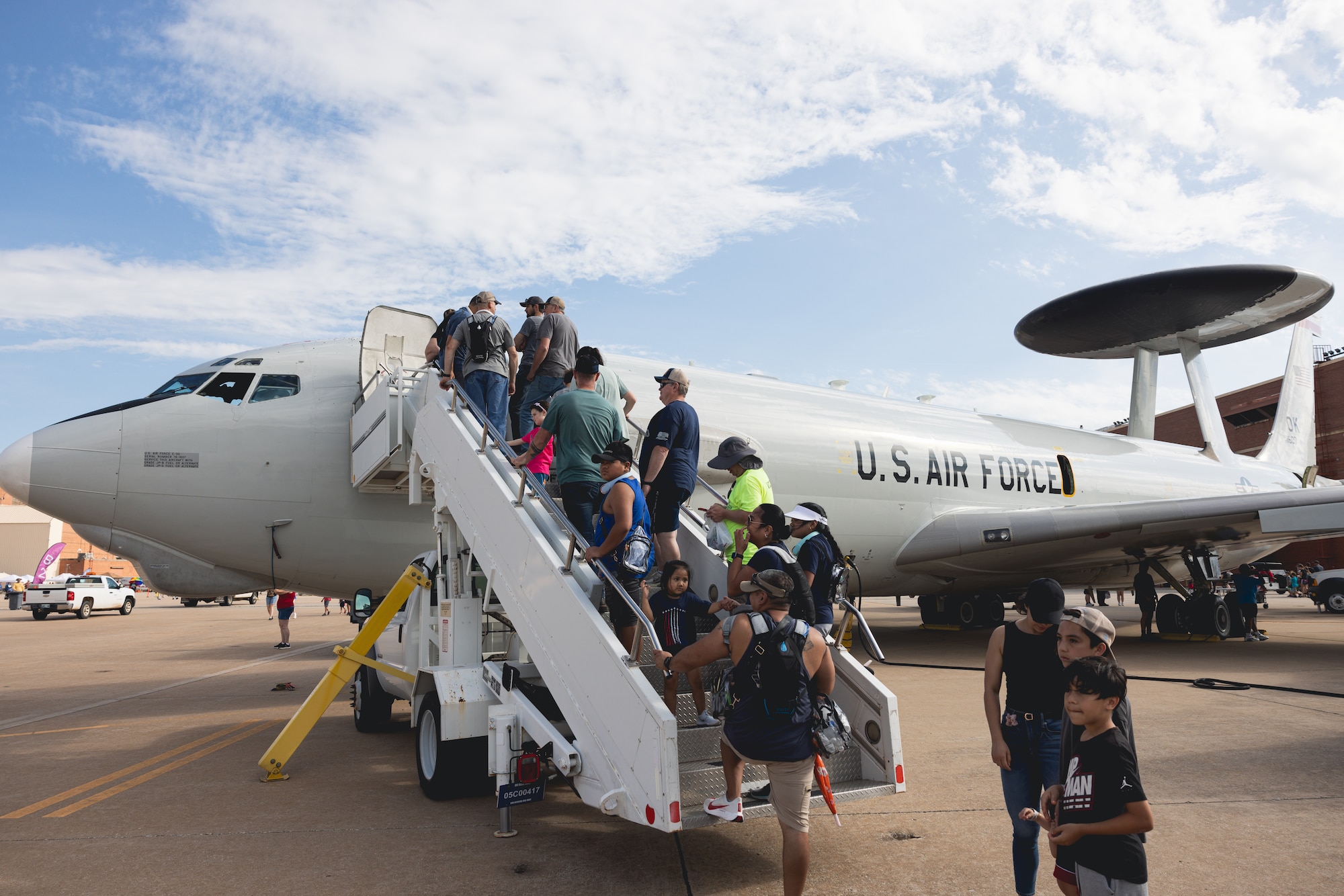 People line up to view aircraft.