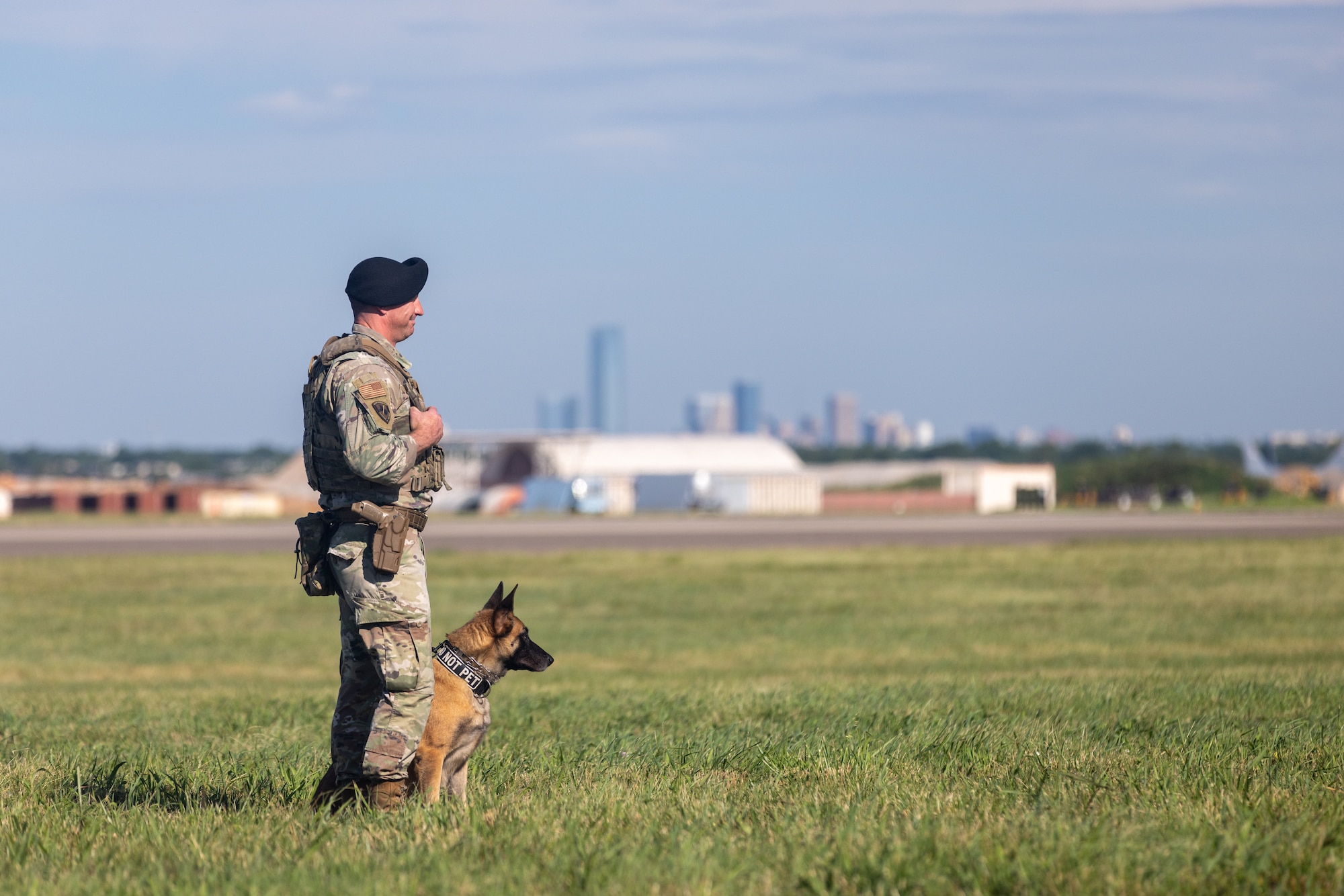 Man standing with dog.