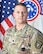 Male Soldier in front of the United States National flag and the United States Army Recruiting Command flag