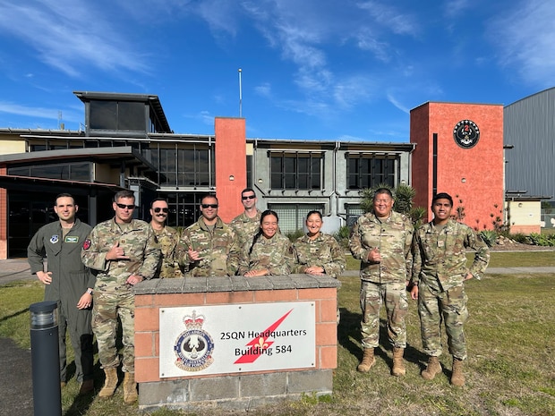 Service members pose for a photo