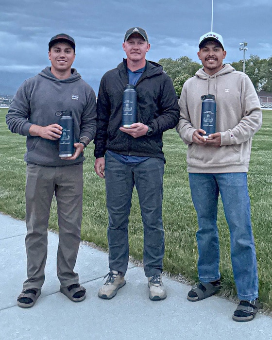 U.S. Air Force Tech. Sgt. Nicholas Frontino (right), 56th Civil Engineer Squadron noncommissioned officer in charge of explosive ordnance disposal operations, Staff Sgt. Jacobo Vasquez Cuartas (left), 56th CES EOD team leader, and Senior Airman Kevin Hodgson (middle), 56th CES EOD team member, pose for a photo, May 13, 2025 at Camp Williams, Utah.