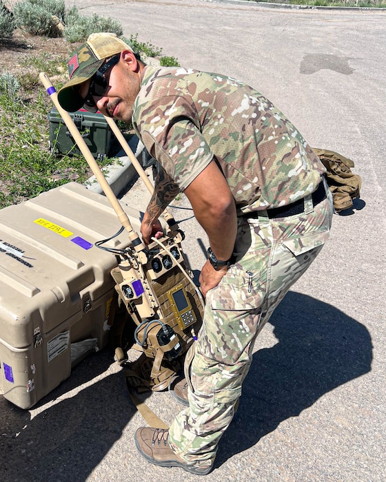 U.S. Air Force Staff Sgt. Jacobo Vasquez Cuartas, 56th Civil Engineer Squadron explosive ordnance disposal operations team leader, grabs a Portable Tactical Robot Controller, May 13, 2025, at Camp Williams, Utah.