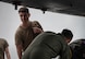 U.S. Air Force Senior Airman Aaron Cusick, center, 23rd Expeditionary Bomb Squadron aircrew flight equipment shift lead, collects aircrew flight equipment from USAF B-52H Stratofortress aircrew after landing from a Bomber Task Force mission at Andersen Air Force Base, Guam, July 23, 2025. Our bomber force, always ready to respond, is a powerful example of how the USAF deters threats and enhances security for ourselves, our partners, and our allies around the world. (U.S. Air Force photo by Senior Airman Alyssa Bankston)