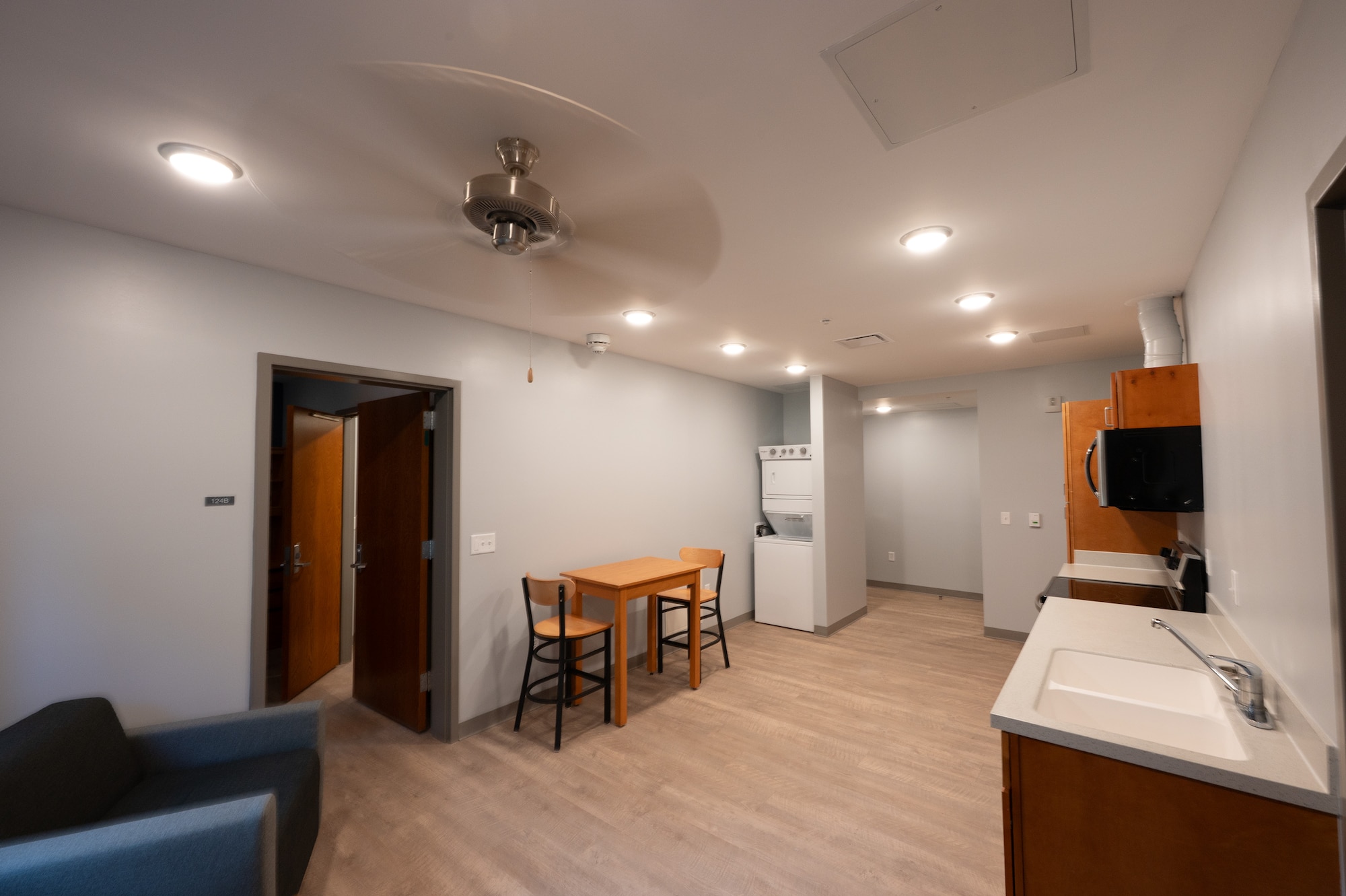 A newly finished view of the walk-in closet and bathroom of new dorm facility.