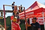 NORFOLK, VA (Oct. 19, 2024) - Guests of Naval Station Norfolk's Fleet Fest 2024 conduct pull-ups at the United States Marine Corps booth.
