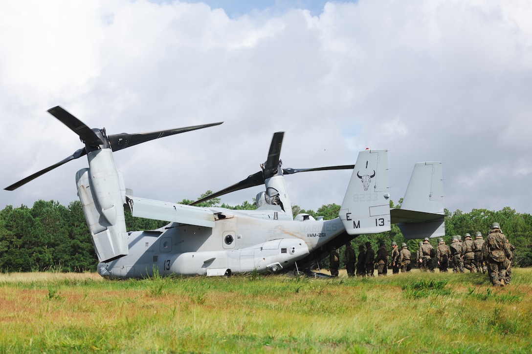 U.S. Navy Reserve Officers’ Training Corps (ROTC) Midshipmen enter an MV-22 Osprey aircraft  with Marine Medium Tiltrotor Squadron 261 (VMM-261) during Fleet Marine Force East (FMF-E) at Marine Corps Base Camp Lejeune, North Carolina, July 17, 2025. 2nd Battalion, 2nd Marine Regiment provided coordination and safety support during FMF-E, a training event with the purpose of familiarizing NROTC Midshipmen who have committed to becoming Marine Corps officers with the primary communities they may serve in. (U.S. Marine Corps photo by Sgt. Jorge Borjas)