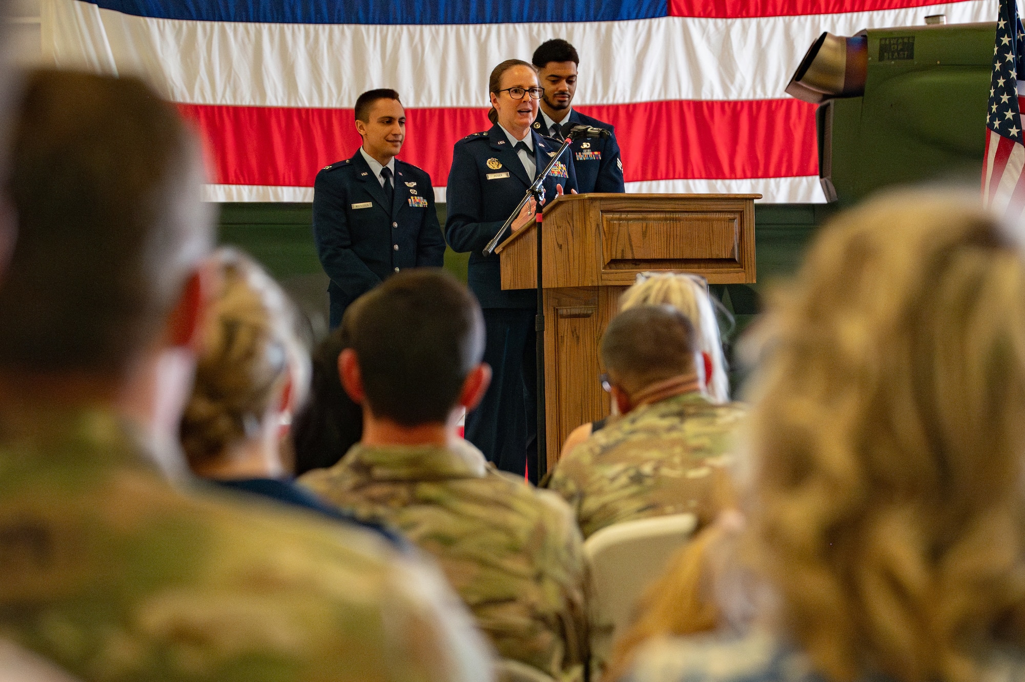 Maj. Gen. Stacy Huser, 20th Air Force commander and presiding officer, speaks to the crowd during the 582nd Helicopter Group change of command ceremony at F.E. Warren Air Force Base, Wyoming, July 15, 2025. The change of command ceremony reflects the orderly transition of authority within military ranks, reinforcing continuity and trust in leadership. (U.S. Air Force photo by Airman Nicholas Rowe)