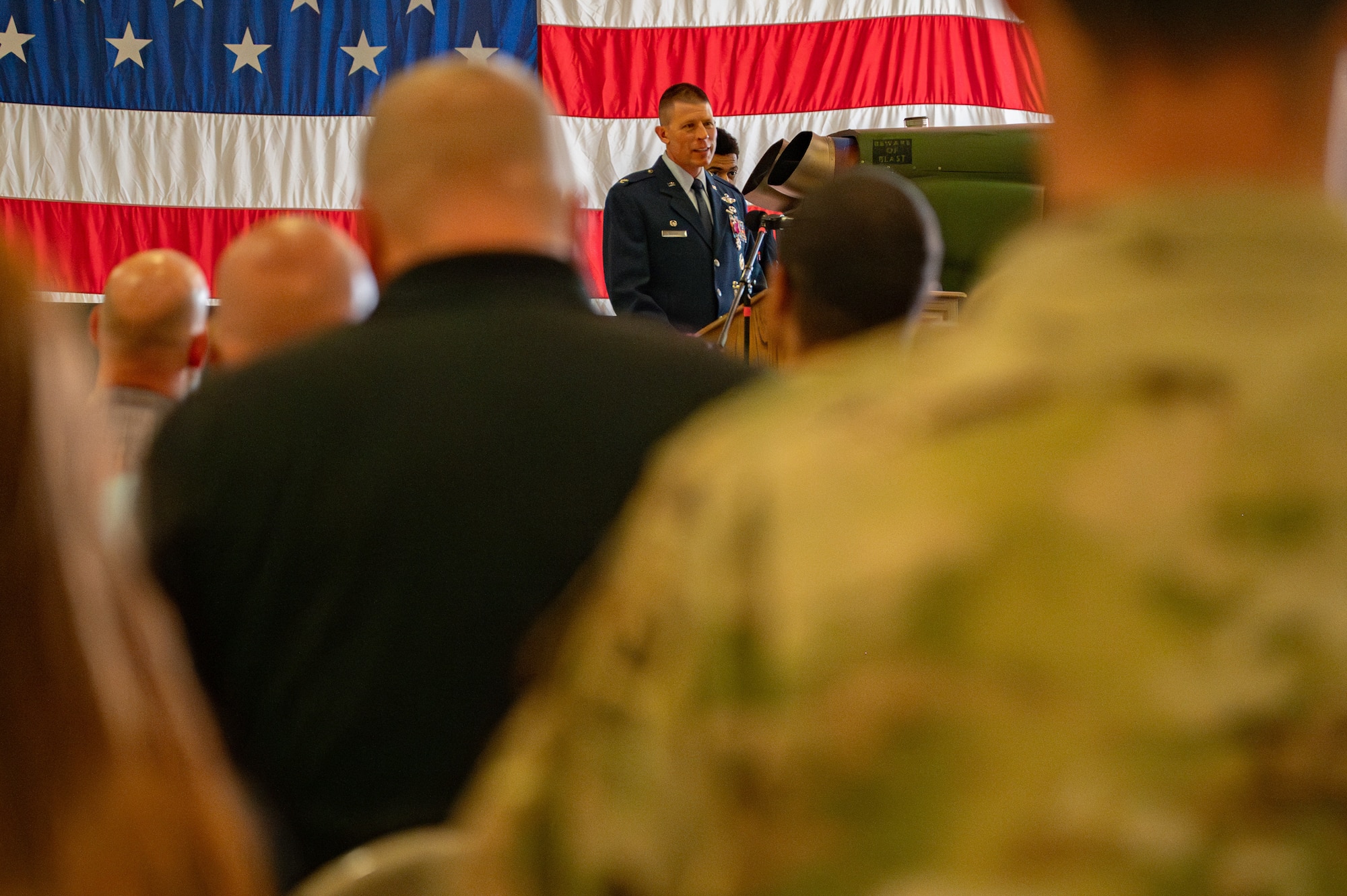 Col. Philip Bryant, 582nd Helicopter Group outgoing commander, speaks to the crowd during the 582 HG change of command ceremony at F.E. Warren Air Force Base, Wyoming, July 15, 2025. The change of command ceremony reflects the orderly transition of authority within military ranks, reinforcing continuity and trust in leadership. (U.S. Air Force photo by Airman Nicholas Rowe)
