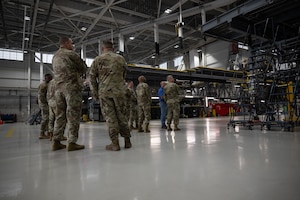 U.S. Air Force Brig. Gen. Anthony Babcock, Air Mobility Command director of logistics, engineering and force protection, tours the 436th Maintenance Squadron C-5M isochronal inspection dock at Dover Air Force Base, Delaware, June 18, 2025. Babcock's visit to the 436th Airlift Wing included the 436th Mission Generation Group, Air Force Mortuary Affairs Operations, Armed Forces Medical Examiner System, the 436th MXS C-5M isochronal inspection dock and was the keynote speaker for the 436th MGG Mission Generator Awards banquet. (U.S. Air Force photo by Airman 1st Class Liberty Matthews)