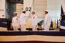 KINGS BAY, GA. (June 18, 2025) – Incoming Commanding Officer Capt. Gregory Price salutes Vice Adm. Johnny Wolfe, Jr., Director, Strategic Systems Programs, during a traditional change of command ceremony aboard Naval Submarine Base Kings Bay, Ga. Price relieved Capt. Juan Hines as commanding officer of Strategic Weapons Facility, Atlantic (SWFLANT). SWFLANT’s mission is to deliver safe, secure and effective sea-based strategic deterrence capabilities to fleet ballistic missile submarines.  (U.S. Navy photo by Ashley Berumen)