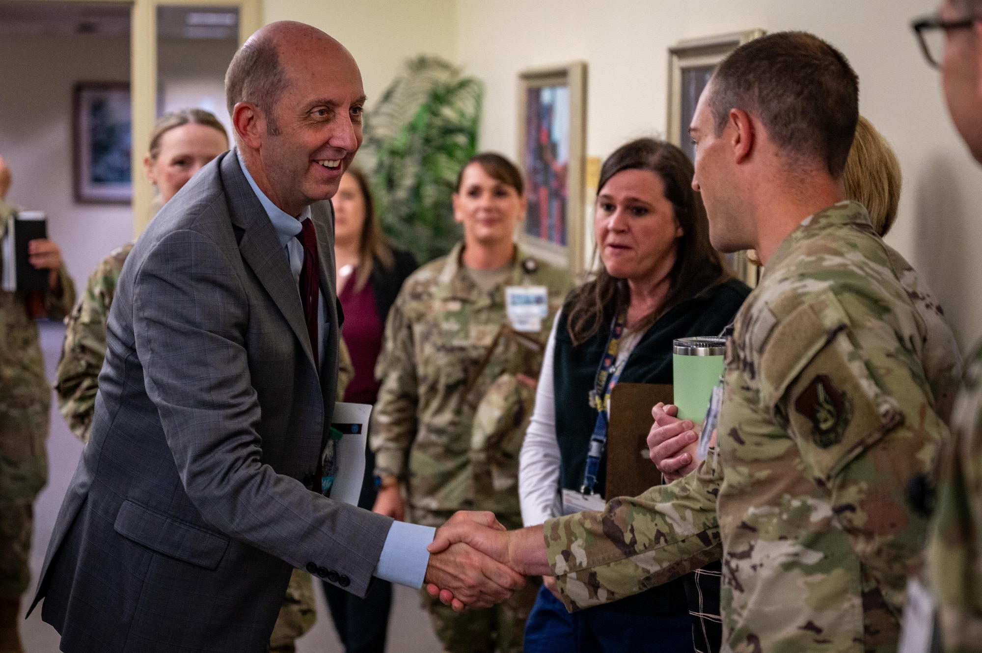 Dr. Stephen Ferrara, acting Assistant Secretary of Defense for Health Affairs, greets U.S. Air Force 673d Medical Group staff at Joint Base Elmendorf-Richardson, Alaska, July 16, 2025.