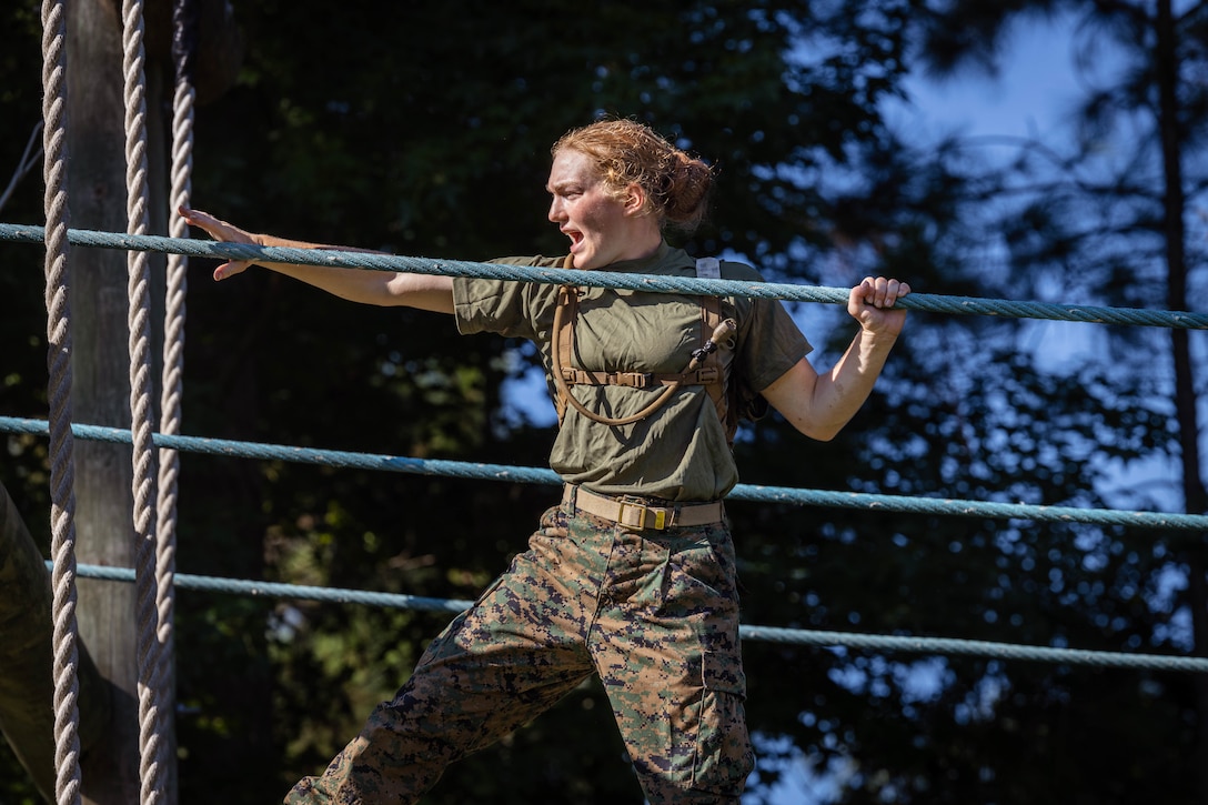 Rct. Peyton Schlegel, a recruit with November Company, 3rd Recruit Training Battalion, navigates the “Monkey Bridge” while completing the Confidence Course aboard Marine Corps Recruit Depot Parris Island, S.C., July 23, 2025. The Confidence Course helps recruits overcome their fears while developing physical and mental courage within themselves.