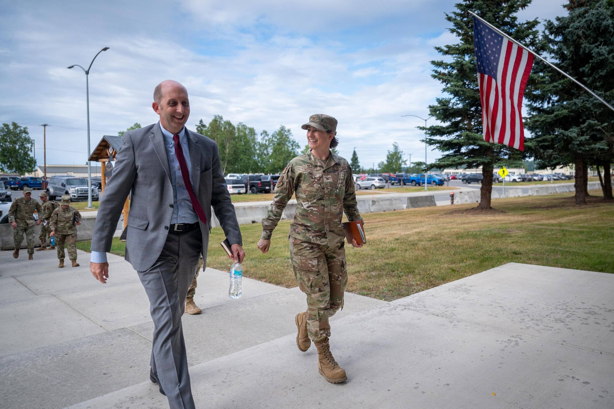 Dr. Stephen Ferrara, acting Assistant Secretary of Defense for Health Affairs, walks with U.S. Air Force Col. Lisa Mabbutt, the Joint Base Elmendorf-Richardson and 673d Air Base Wing commander, at JBER Alaska, July 16, 2025.
