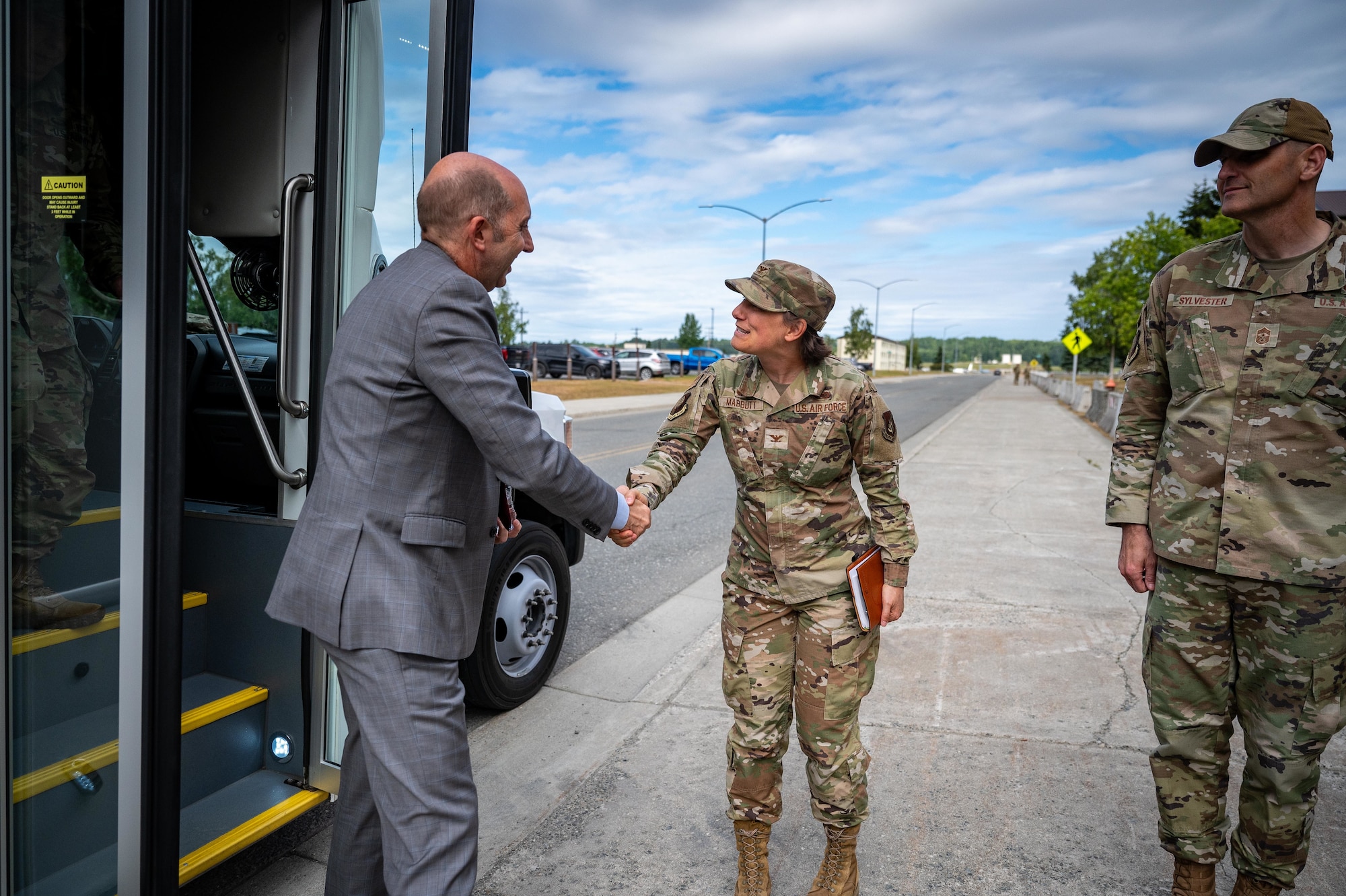 Dr. Stephen Ferrara, acting Assistant Secretary of Defense for Health Affairs, greets U.S. Air Force Col. Lisa Mabbutt, the Joint Base Elmendorf-Richardson and 673d Air Base Wing commander, at JBER, Alaska, July 16, 2025.