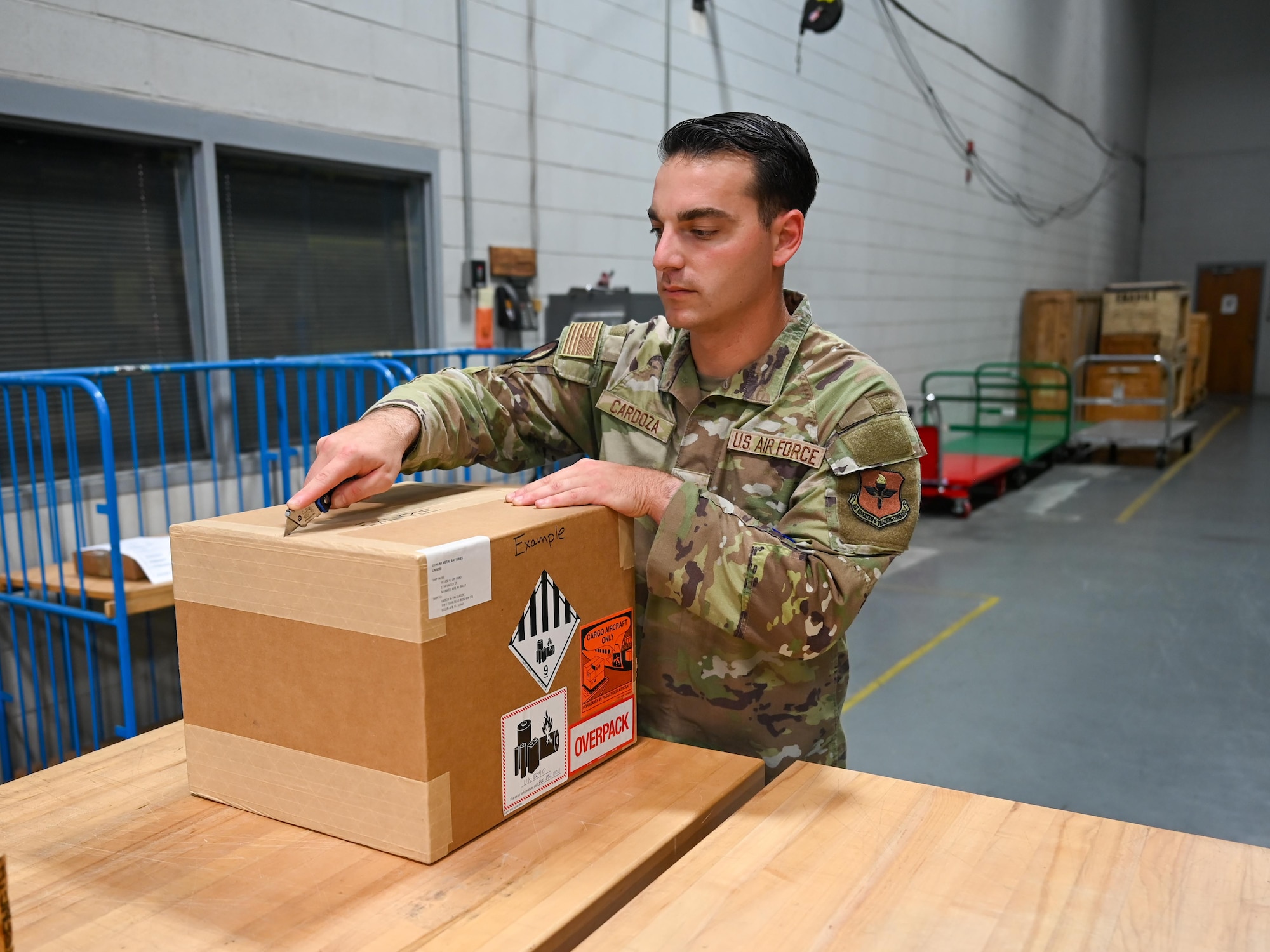 U.S. Air Force Staff Sgt. John Cardoza, 42d Logistics Readiness Squadron noncommissioned officer in charge of outbound cargo, packages items to protect them during transportation at Maxwell Air Force Base, Alabama, July 23, 2025. The 42d LRS team uses boxes as one of the best packaging materials for safeguarding assets, as they can store large quantities of material when multiple items are consolidated together. (U.S. Air Force photo by Senior Airman Tanner Doerr)