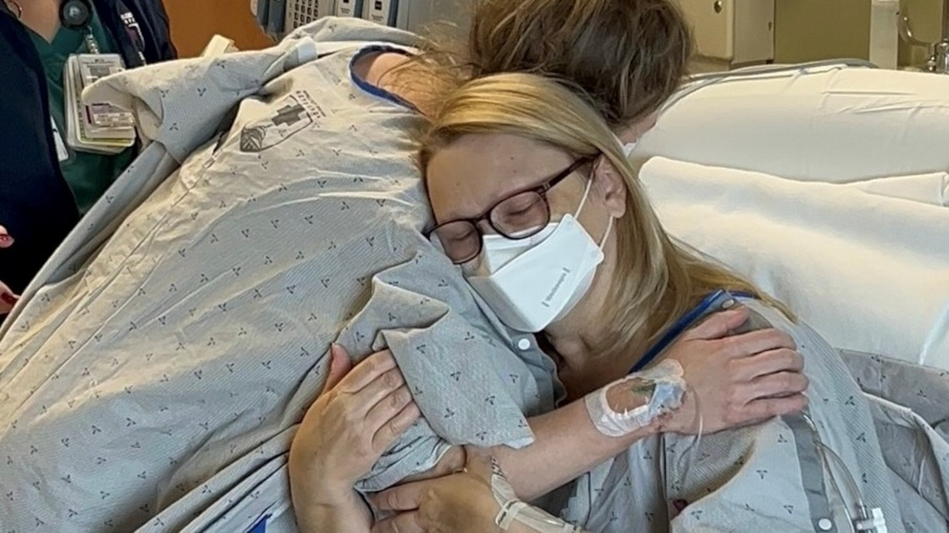 A grateful Catherine Higginbotham, right, embraces kidney donor Megan Boyd at Walter Reed National Military Medical Center in Bethesda, Maryland on Mar. 24, 2024, just one day after the life-changing surgeries. (Photo courtesy of Catherine Higginbotham)