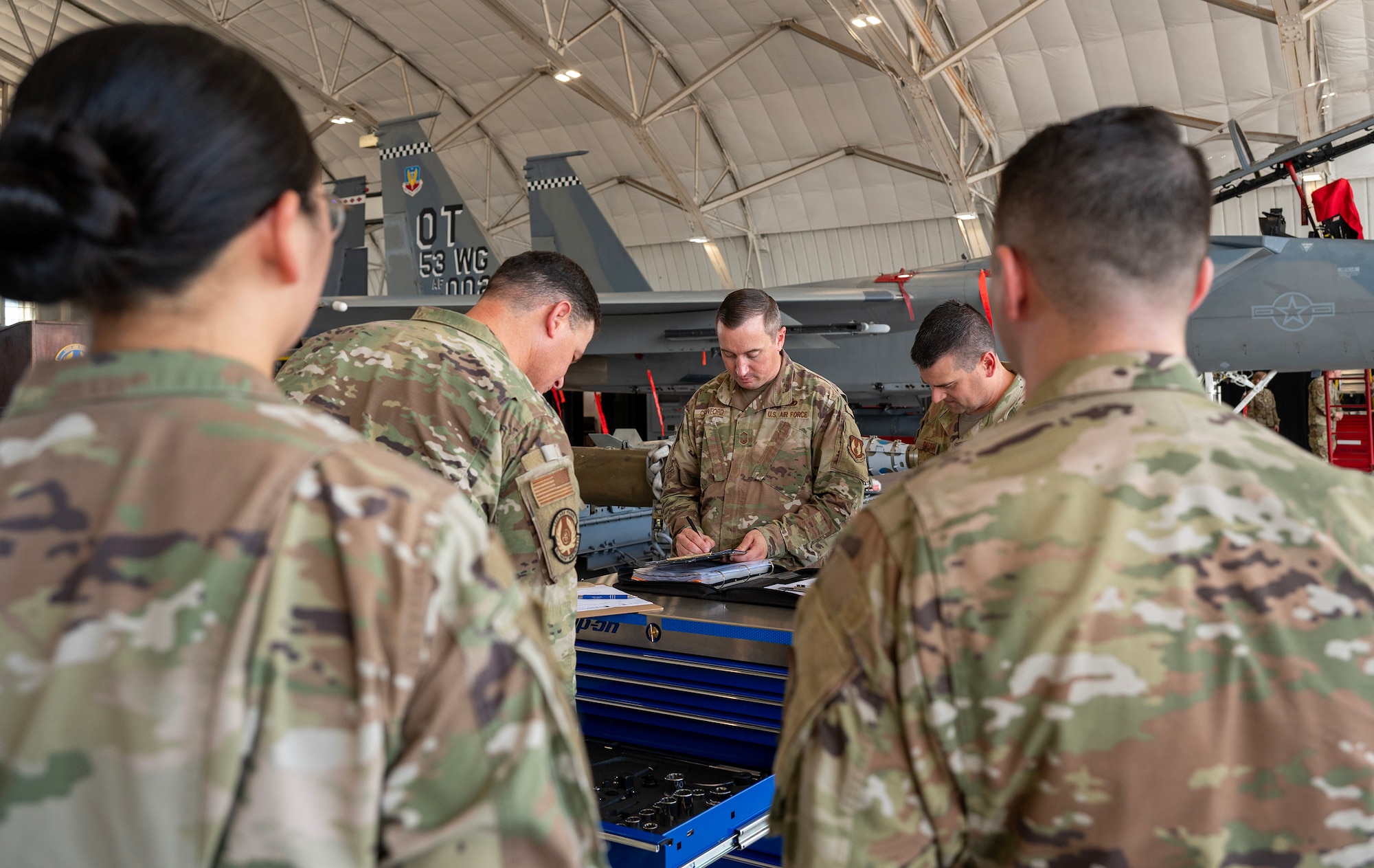 A team of three 96th Aircraft Maintenance Squadron senior NCOs inspect the (blue) aircraft maintenance unit team’s tool cart and forms and publications.