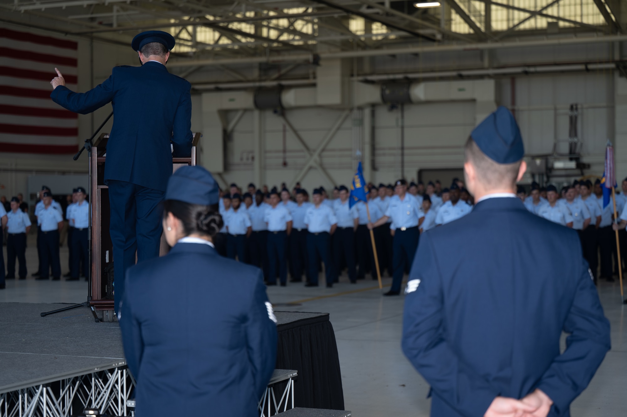 Col. Cory Damon, 22nd Air Refueling Wing commander, gives a speech during the 22nd ARW change of command ceremony at McConnell Air Force Base, Kansas, July 28, 2025. Damon gave his departing speech thanking everyone in attendance, his team, his family, and McConnell as a whole. (U.S. Air Force photo by Senior Airman Amelio Brown)