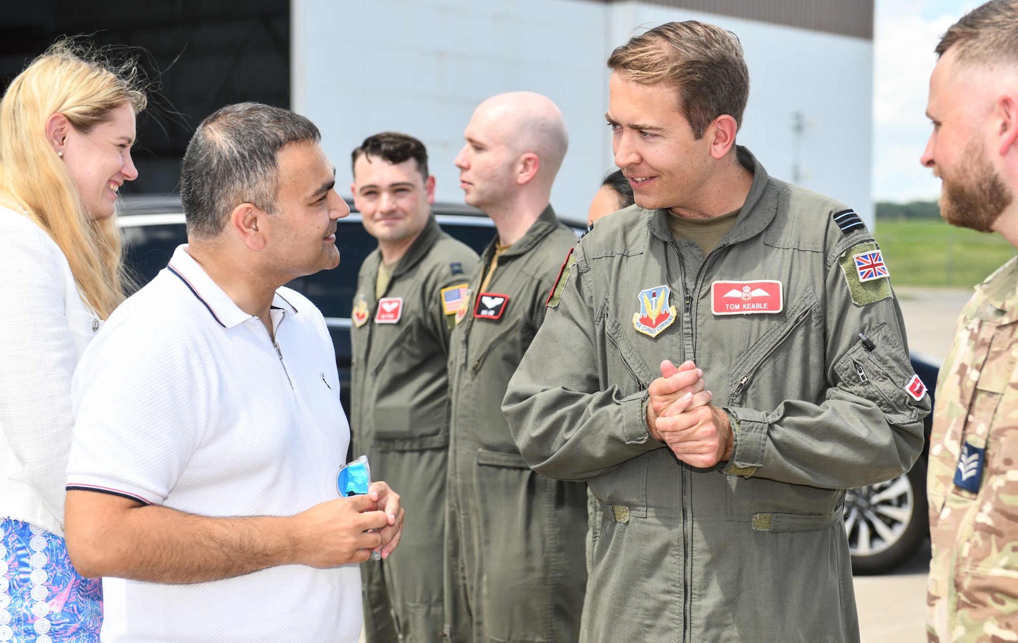 Mr. Peter Bedford, MP for Mid Leicestershire, speaks to Flt. Lt. Tom Keable, 343rd Reconnaissance Squadron evaluator pilot, during a visit to Offutt Air Force Base, July 26. Rep. Don Bacon brought two members of U.K. Parliament  out for a tour highlighting the Royal Air Force's partnership with the 55th Wing. (U.S. Air Force photo by Chad Watkins)