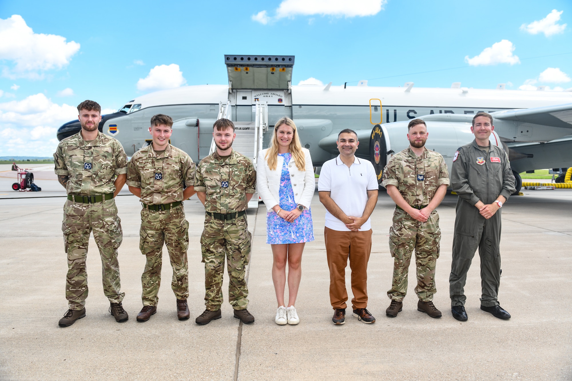 Ms. Charlotte Owen, Baroness Owen of Alderly Edge, and Mr. Peter Bedford, MP for Mid Leicestershire, pose with Royal Air Force airmen in front of an RC-135 RIVET JOINT during a visit to Offutt Air Force Base, July 26. Rep. Bacon brought the two members of U.K. Parliament  out for a tour highlighting the Royal Air Force's partnership with the 55th Wing. (U.S. Air Force photo by Chad Watkins)