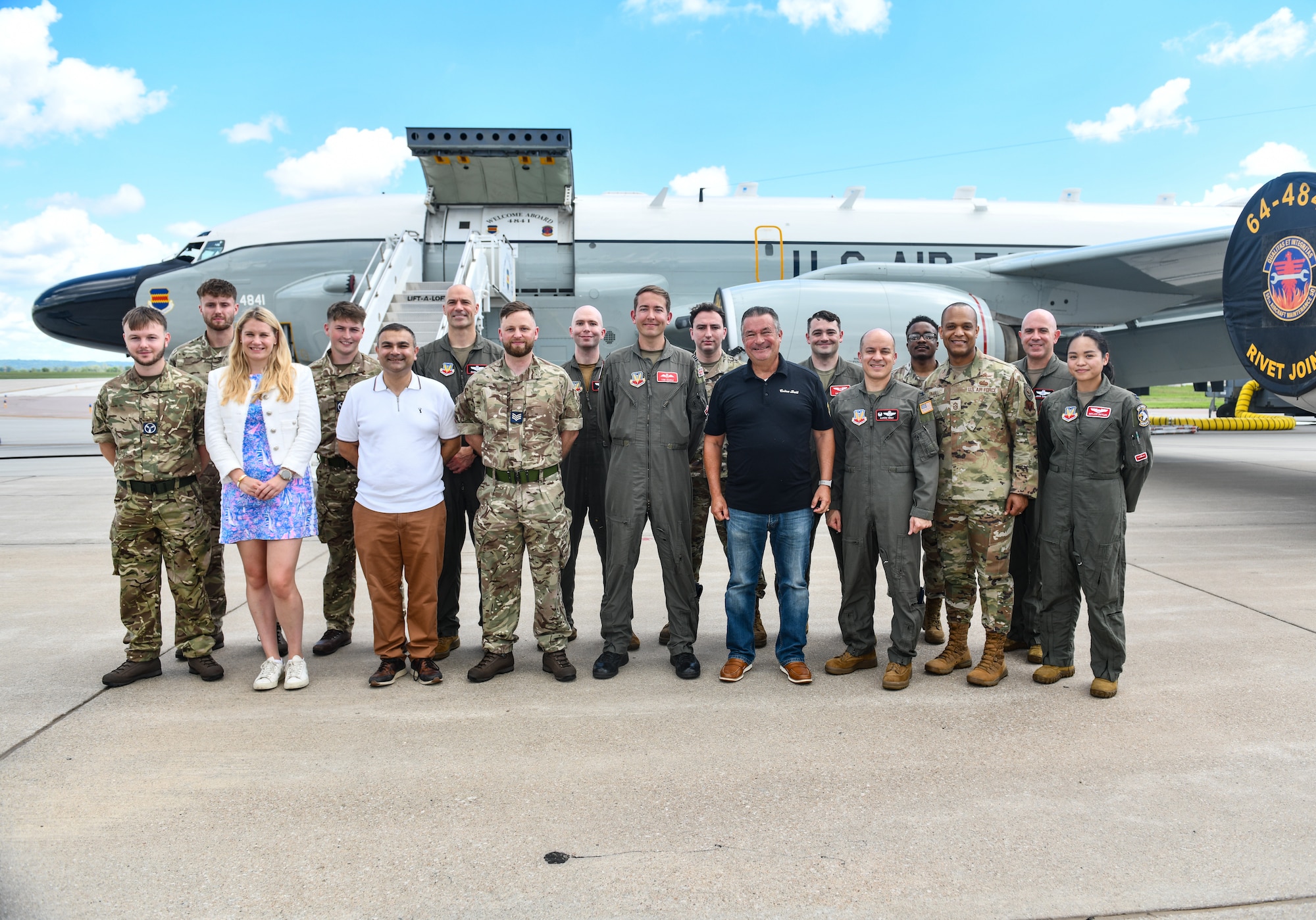 Ms. Charlotte Owen, Baroness Owen of Alderly Edge, Mr. Peter Bedford, MP for Mid Leicestershire, Congressman Don Bacon, Col. Aaron Gray, 55th Wing commander, and Chief Master Sgt. Andrew Small, 55th Wing command chief, pose with U.S. and Royal Air Force airmen in front of an RC-135 RIVET JOINT during a visit to Offutt Air Force Base, July 26. Rep. Bacon brought the two members of U.K. Parliament  out for a tour highlighting the Royal Air Force's partnership with the 55th Wing. (U.S. Air Force photo by Chad Watkins)