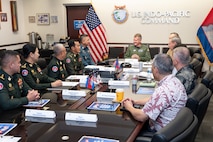 Adm. Samuel J. Paparo, commander of U.S. Indo-Pacific Command, engages with a Royal Cambodian Armed Forces delegation during a Bilateral Defense Dialogue at USINDOPACOM headquarters on Camp H.M. Smith in Honolulu, July 24, 2025.