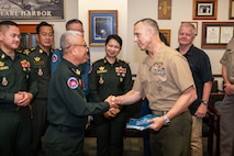 U.S. Marine Corps Maj. Gen. George Rowell, USINDOPACOM director of Strategic Planning and Policy (J5), and Cambodian Lt. Gen. Suon Samnang, chairman of the Military Cooperation Coordination Group, shake hands during a Bilateral Defense Dialogue at USINDOPACOM headquarters on Camp H.M. Smith in Honolulu, July 24-25, 2025.