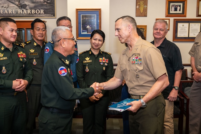 U.S. Marine Corps Maj. Gen. George Rowell, USINDOPACOM director of Strategic Planning and Policy (J5), and Cambodian Lt. Gen. Suon Samnang, chairman of the Military Cooperation Coordination Group, shake hands during a Bilateral Defense Dialogue at USINDOPACOM headquarters on Camp H.M. Smith in Honolulu, July 24-25, 2025.