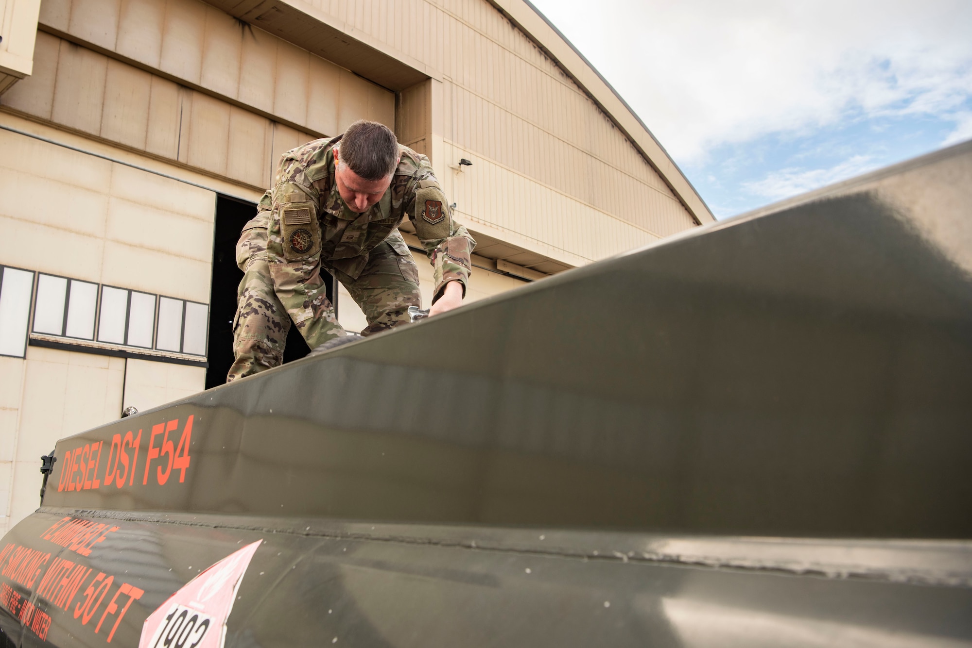U.S. Air Force Master Sgt. Tom Struthers, 927th Logistics Readiness Squadron fuels operations NCO in charge, performs checks before refueling an aircraft tug during Red Flag-Alaska 25-3 at Eielson Air Force Base, Alaska, July 25, 2025.