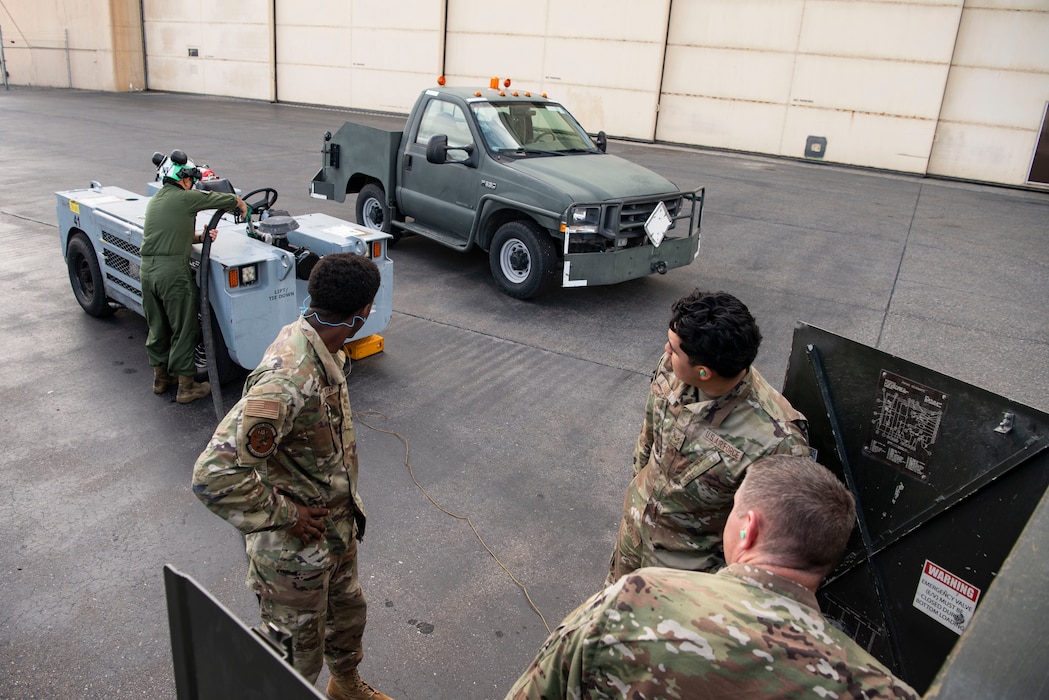 Participants in Red Flag Alaska 25-3 work to refuel an aircraft tug at Eielson Air Force Base, Alaska, July 25, 2025.