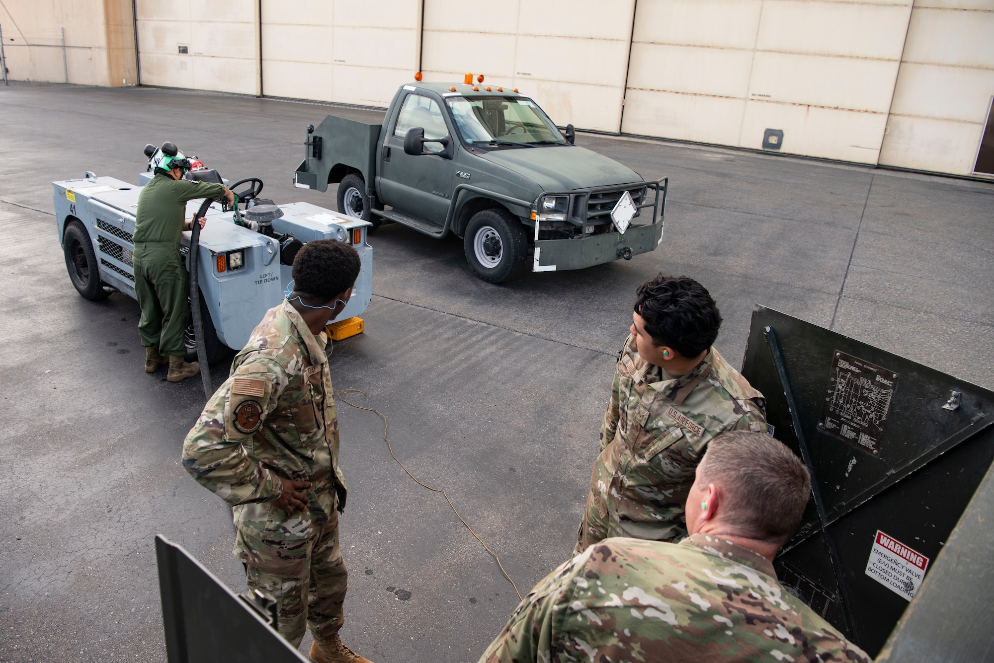 Participants in Red Flag Alaska 25-3 work to refuel an aircraft tug at Eielson Air Force Base, Alaska, July 25, 2025.