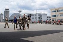 U.S. Air Force Airmen assigned to the 35th Medical Group walk a litter patient onto a C-130J Super Hercules assigned to the 36th Airlift Squadron for a mass casualty exercise during Resolute Force Pacific 2025 at Misawa Air Base, Japan, July 23, 2025.