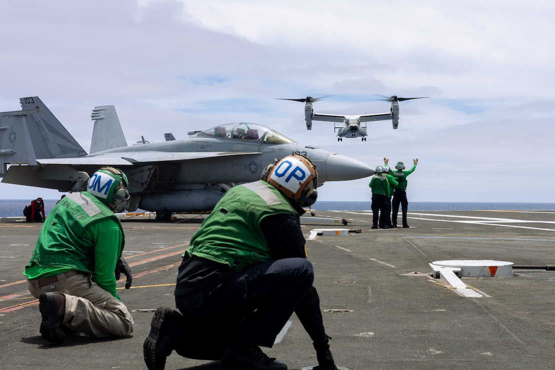 U.S. Navy Sailors direct a V-22 Osprey, assigned to the “Sunhawks” of Fleet Logistics Multi-Mission Squadron (VRM) 50, as it prepares to land on the flight deck of the Nimitz-class aircraft carrier USS Theodore Roosevelt (CVN 71), July 26, 2025.