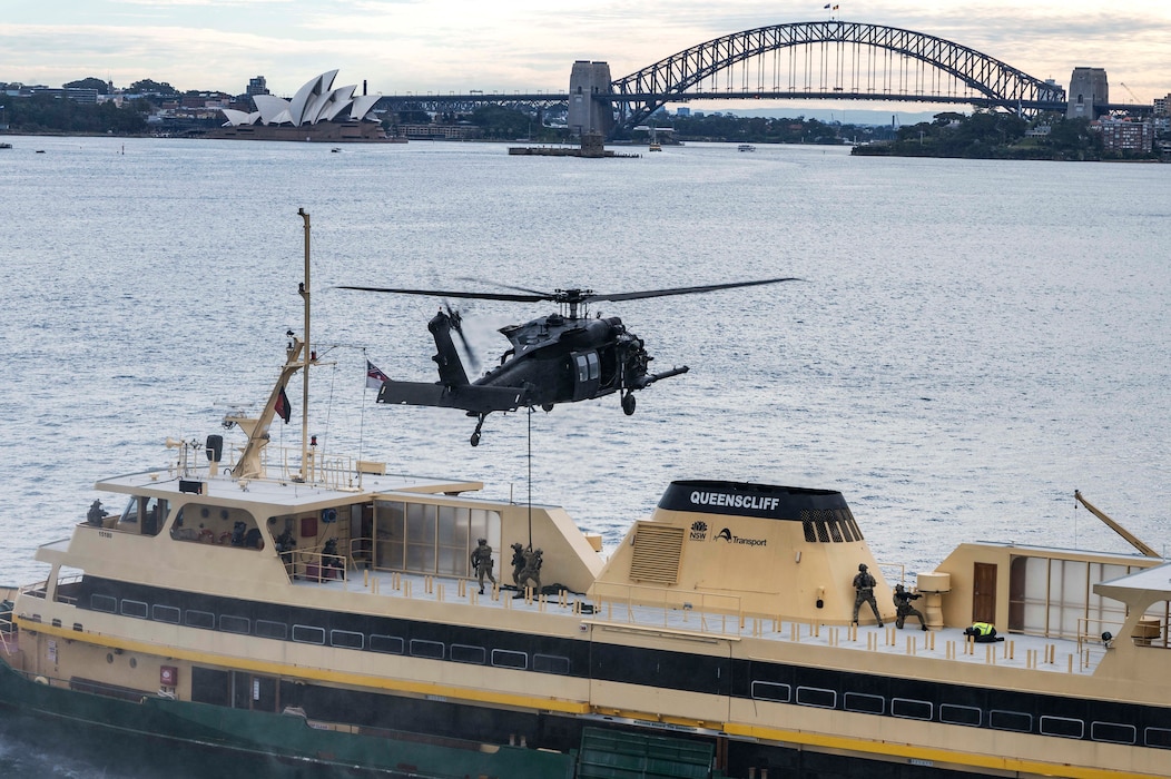 NEW SOUTH WALES, Australia (July 8, 2025) — U.S. Naval Special Warfare (NSW) operators, soldiers from Australia’s Special Operations Command, and United Kingdom Royal Marine Commandos from 42 Commando board a simulated target vessel for Visit, Board, Search and Seizure training with a U.S. Army MH-60 helicopter assigned to 160th Special Operations Aviation Regiment (Airborne) during exercise Talisman Sabre 25 in New South Wales, Australia, July 8, 2025. Talisman Sabre is the largest bilateral military exercise between Australia and the United States, with multinational participation, advancing a free and open Indo-Pacific by strengthening relationships and interoperability among key allies and enhancing our collective capabilities to respond to a wide array of potential security concerns. NSW provides maritime special operations force capabilities to enable Joint Force lethality and survivability inside denied and contested areas. (U.S. Navy photo by Mass Communication Specialist 2nd Class David Rowe)
