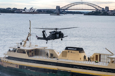 NEW SOUTH WALES, Australia (July 8, 2025) — U.S. Naval Special Warfare (NSW) operators, soldiers from Australia’s Special Operations Command, and United Kingdom Royal Marine Commandos from 42 Commando board a simulated target vessel for Visit,...