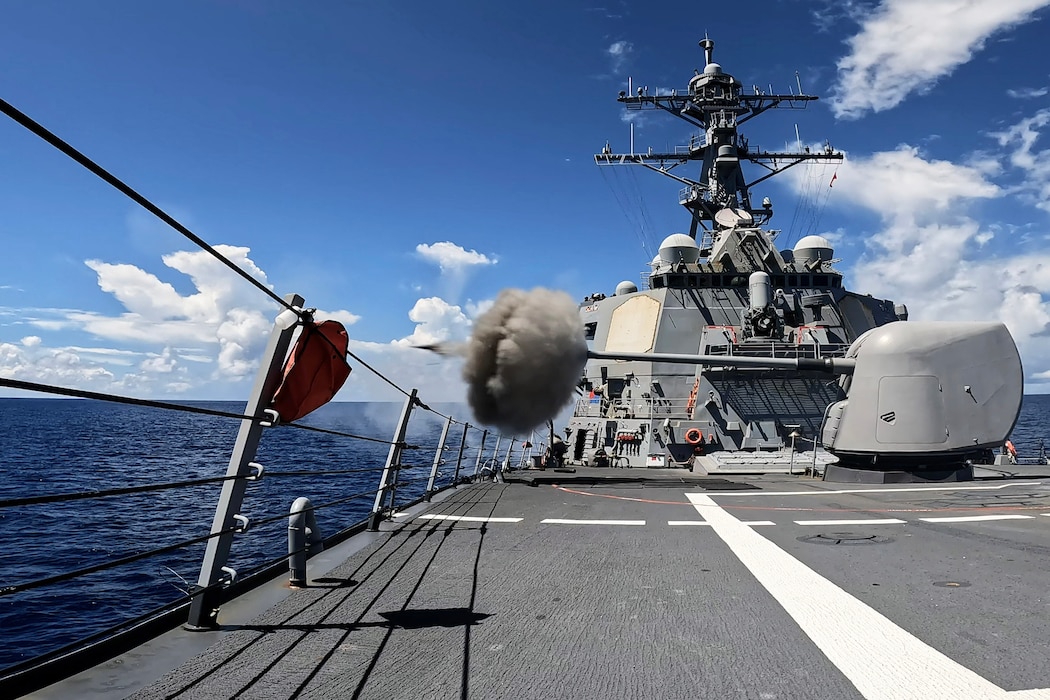 The Arleigh Burke-class guided-missile destroyer USS Milius (DDG 69) fires the Mark 45 5-Inch light-weight gun during a live-fire weapons exercise in the Indian Ocean, July 24, 2025.