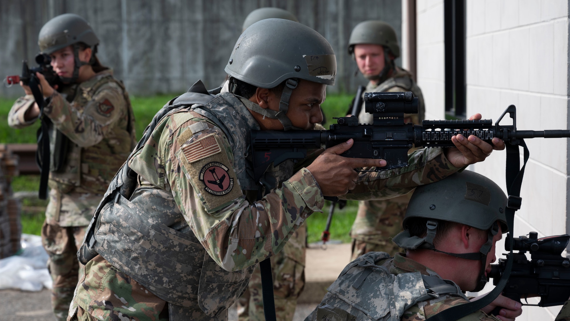 U.S. Air Force Senior Airman Javian Jones, 51st Logistics Readiness Squadron passenger travel technician, holds position during the ability to survive and operate training at Osan Air Base, Republic of Korea, July 24, 2025. Team movement and building-clearing techniques in close-quarters environments are key components of the weapons handling segment of ATSO training. (U.S. Air Force photo by Senior Airman Rome Bowermaster)