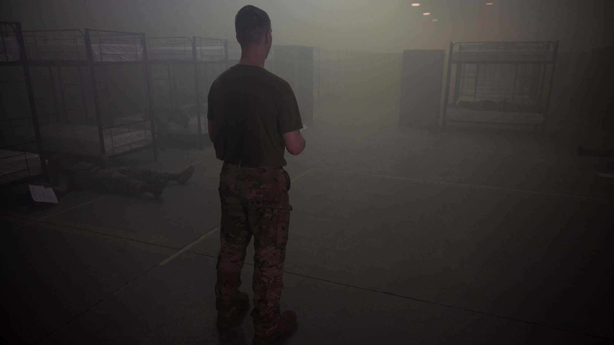 U.S. Air Force Senior Airman Steven Brost, 51st Civil Engineer Squadron logistics officer, instructs Airmen during tactical combat casualty care at Osan Air Base, Republic of Korea, July 24, 2025. During the ability to survive and operate training, Airmen were split into two teams and given a realistic scenario where they were expected to demonstrate their TCCC training in a contingency environment. (U.S. Air Force photo by Senior Airman Rome Bowermaster)