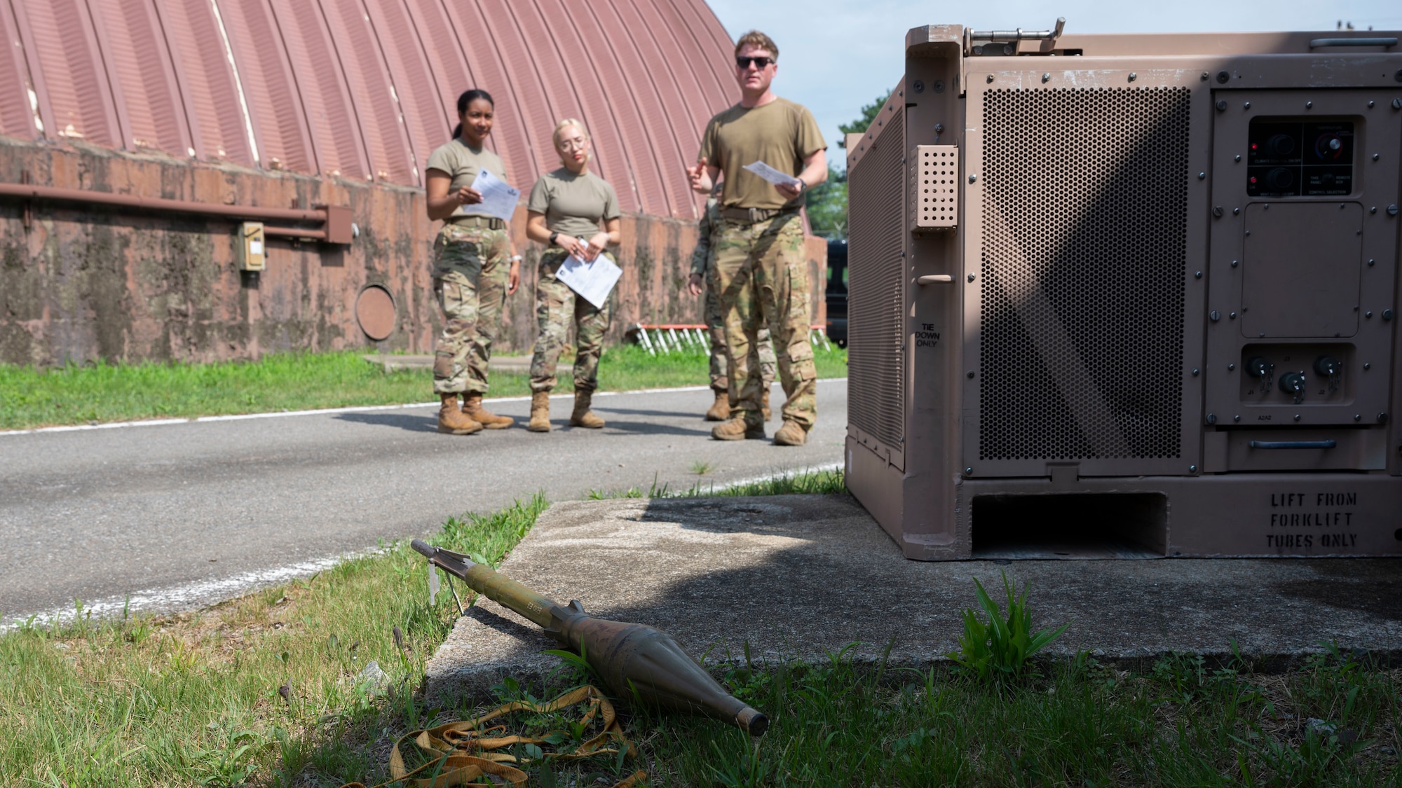 U.S. Air Force Senior Airman Kyler Friend, right, 51st Civil Engineer Squadron explosive ordinance disposal team member, trains Airmen on unexploded ordinance identification at Osan Air Base, Republic of Korea, July 24, 2025. In a contingency environment UXOs may be found throughout the base. It is essential that all Airmen assigned to Osan are prepared to operate in small teams to locate and identify unexploded ordnance and to coordinate with the appropriate units for safe retrieval and disposal. (U.S. Air Force photo by Senior Airman Rome Bowermaster)