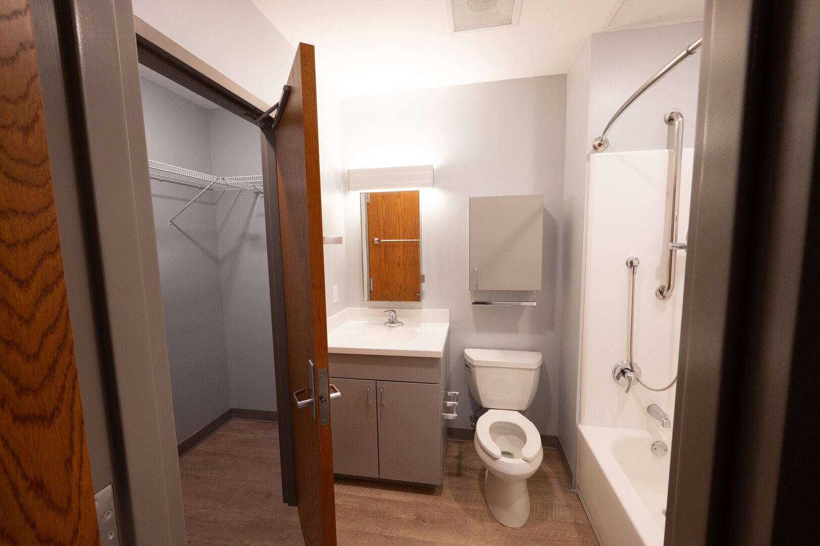 A newly finished view of the walk-in closet and bathroom of new dorm facility.